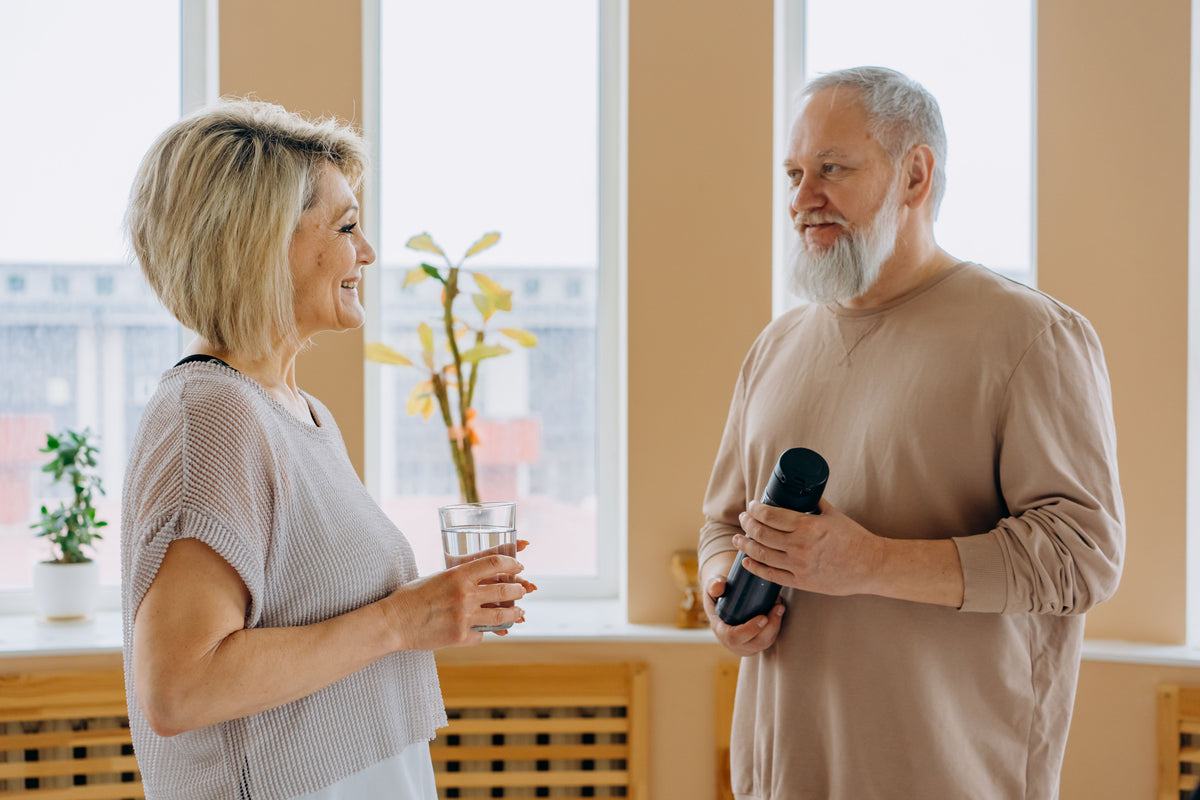Older couple enjoying a conversation at home